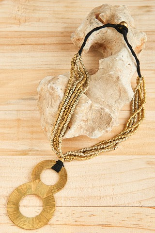 Dhokra Infinity necklace twirled beautifully with gorgeous brass gold pendant and brass beads in black cotton thread