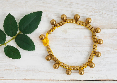 Ethno Dhokra anklet with brass bead in different sizes and yellow cotton thread