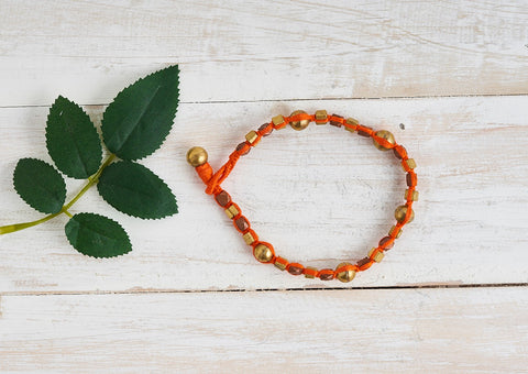 Ethno Dhokra anklet with Dhokra brass and copper beads and orange cotton thread